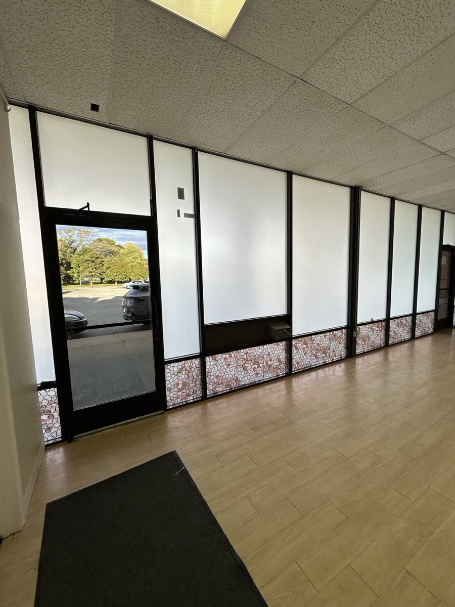 Office hallway with frosted privacy film on the glass partitions
