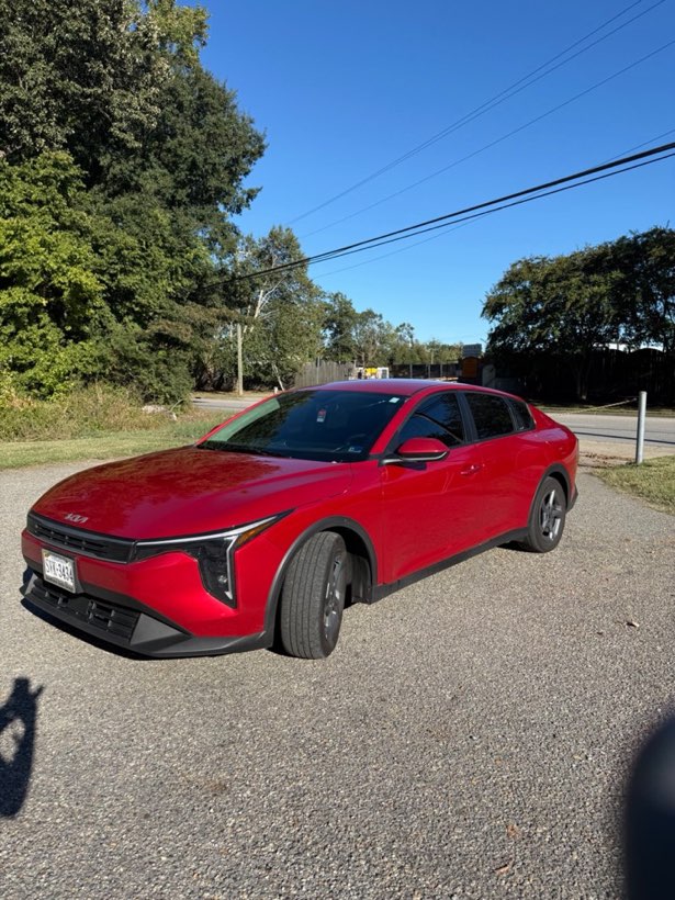 Red 2024 Kia K4 with window tint at Patriot Tinting in Hampton, Virginia