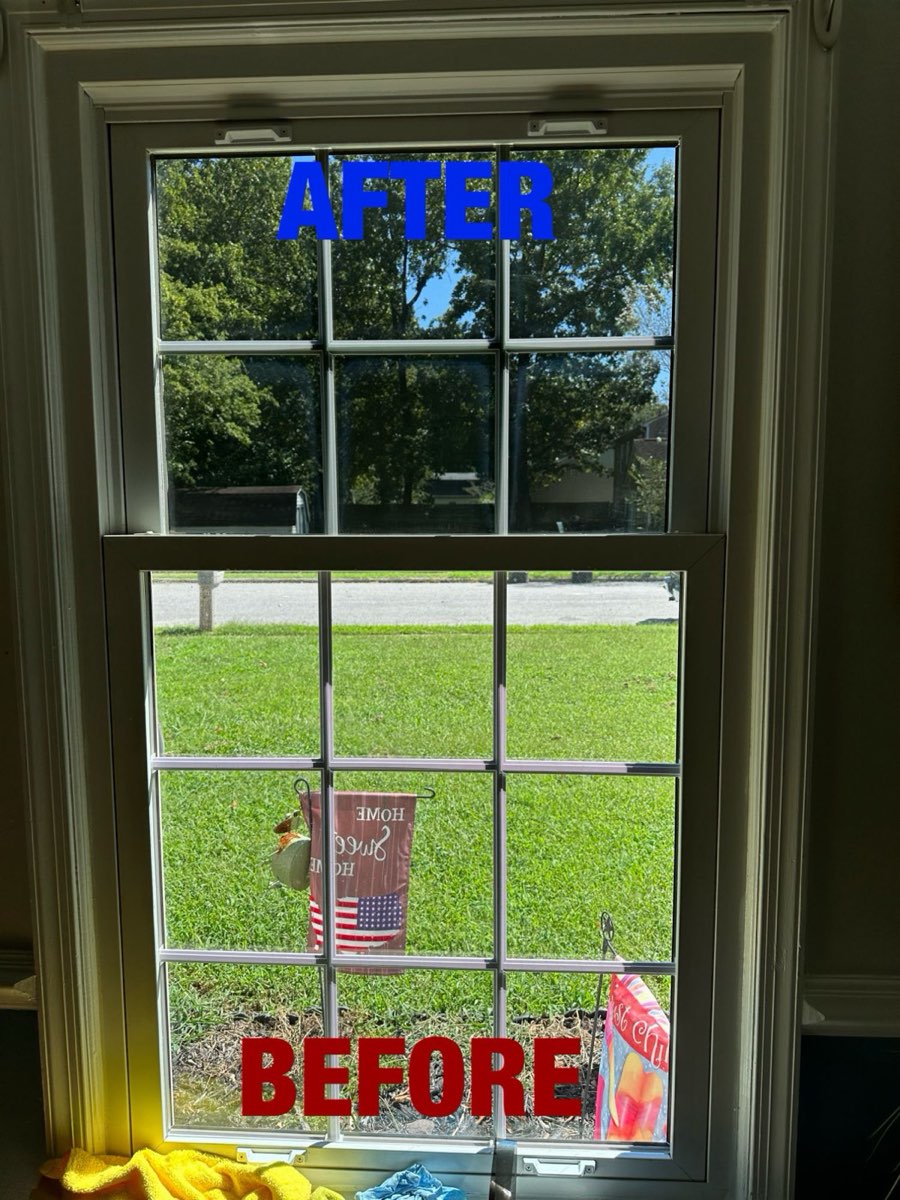 Double-hung window with film on the top sash and the bottom sash still clear